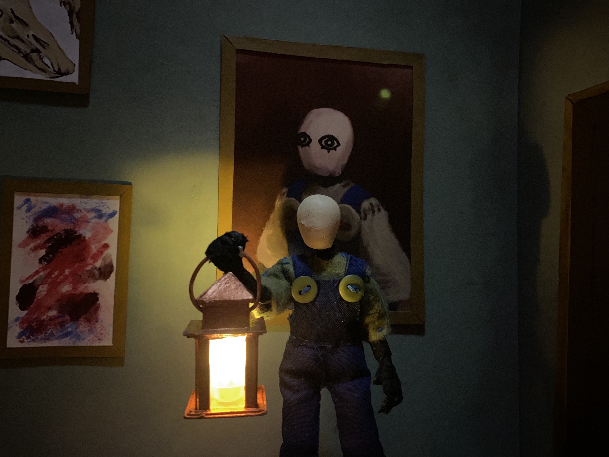 puppet standing in front of painting