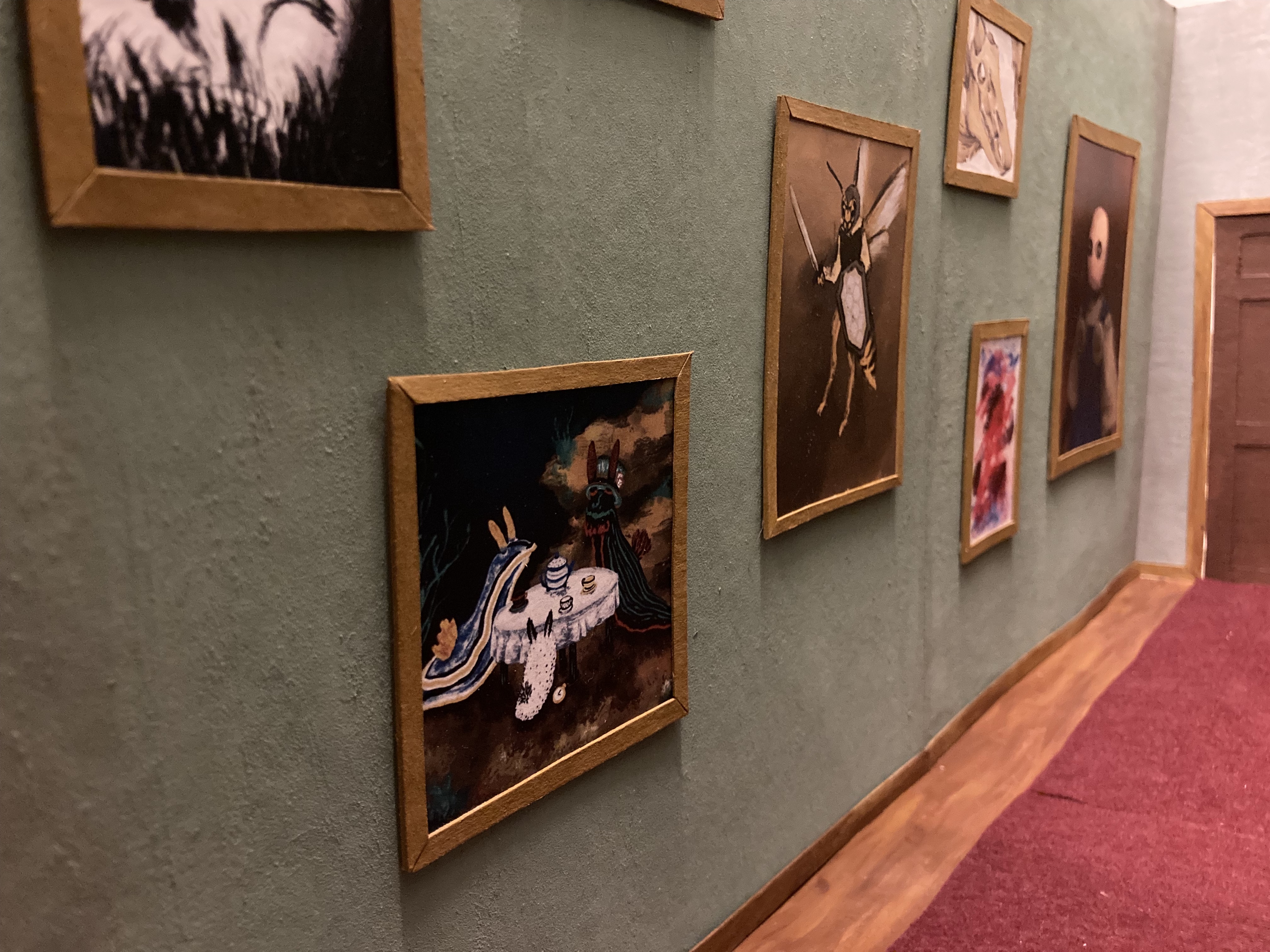 lit hallway set showing the side with the portrait